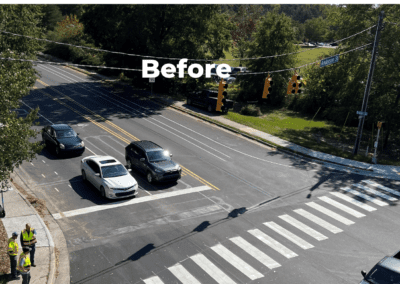 A couple of cars are parked on the side of the road