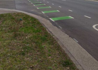 A street with green lines painted on it.